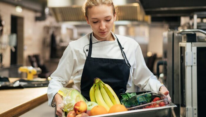 front-view-female-chef-holding-tray-with-fruit_23-2148763115 front-view-female-chef-holding-tray-with-fruit_23-2148763115